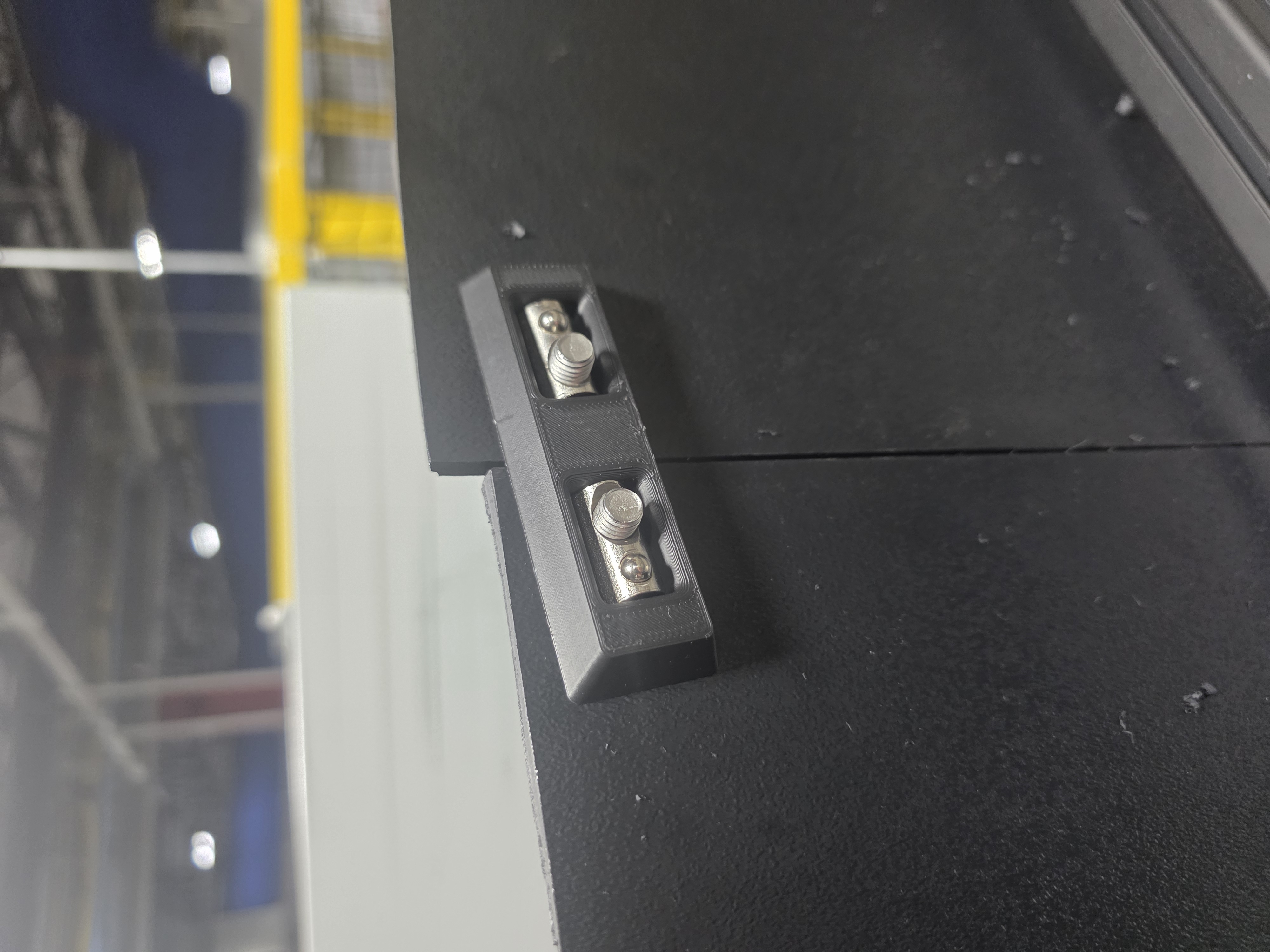 Panel aligner bracket — back side installed