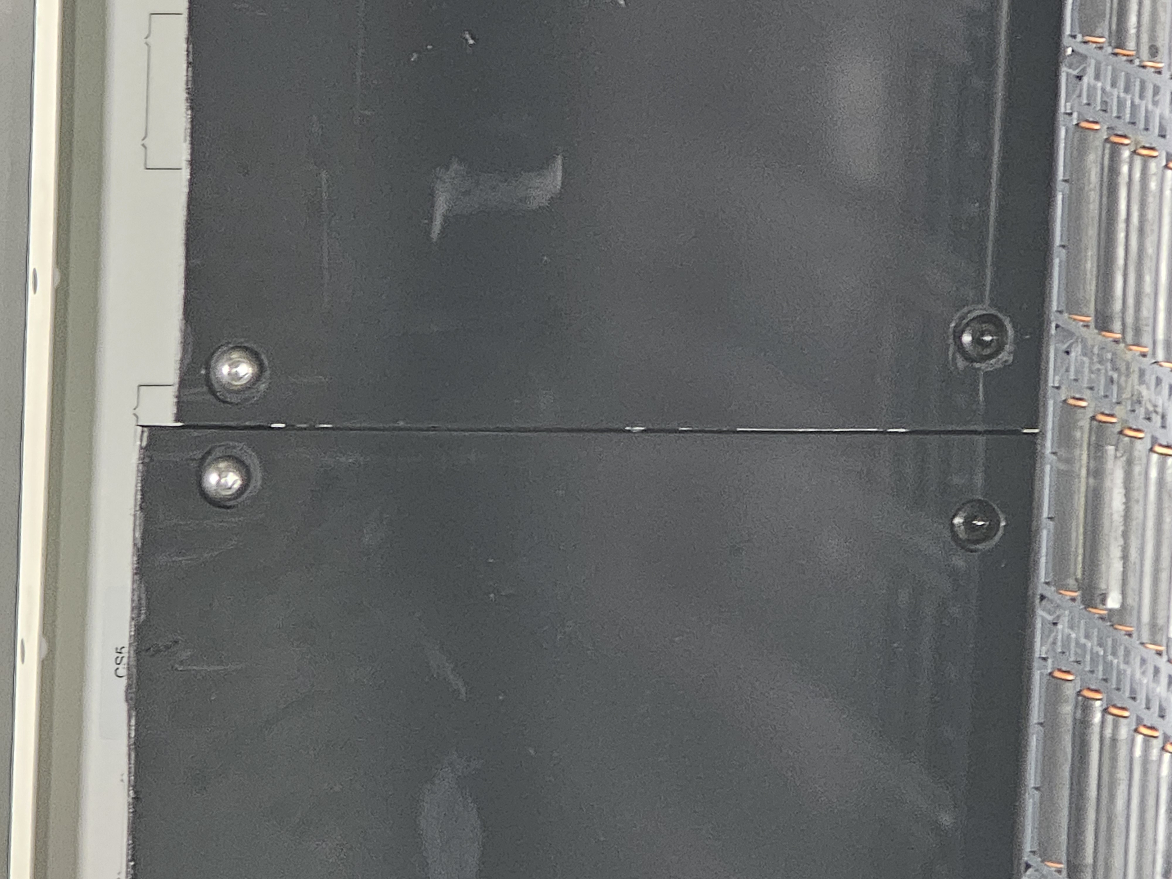 Panel aligner bracket — conveyor side