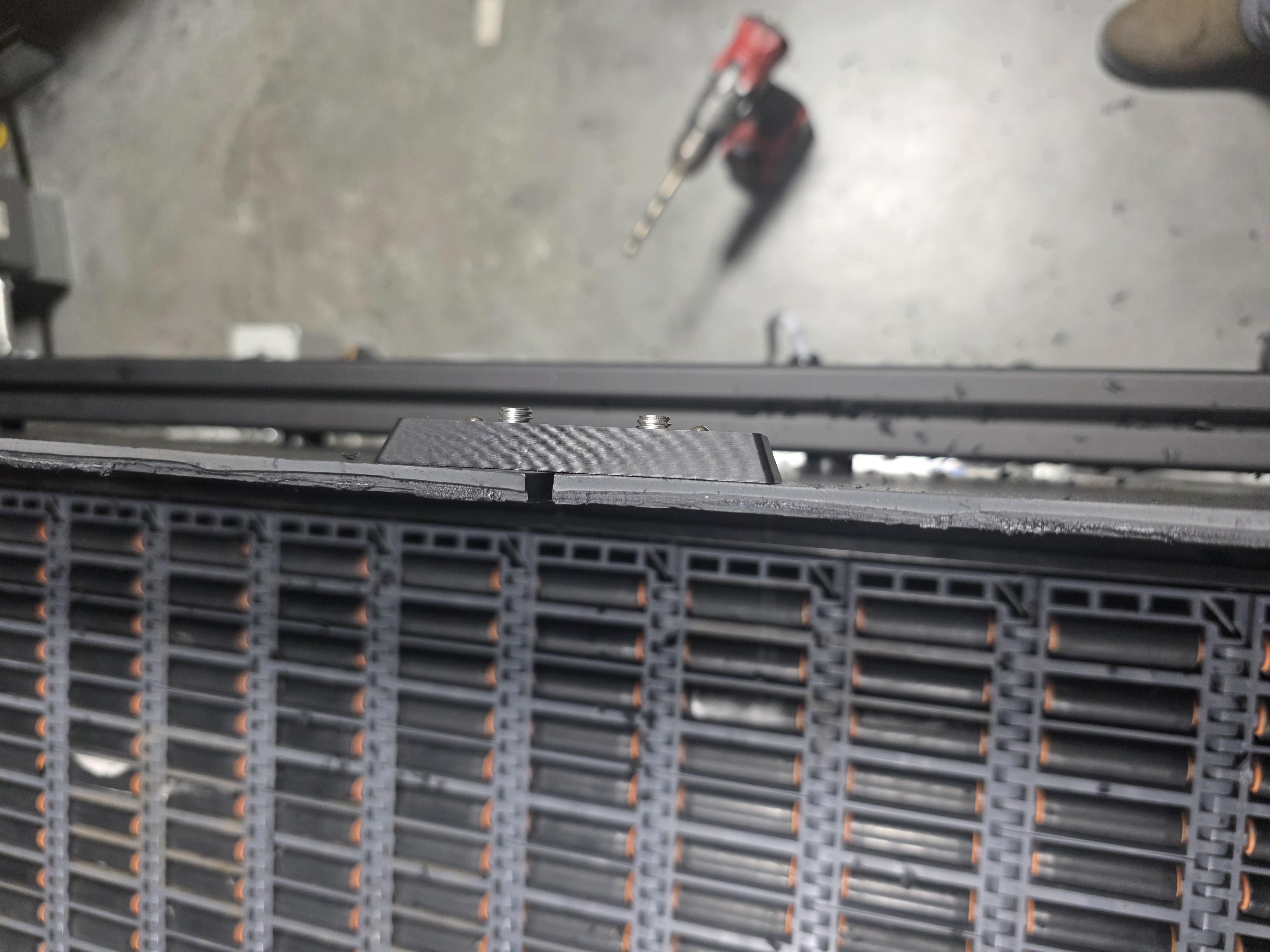 Panel aligner bracket — top-down view