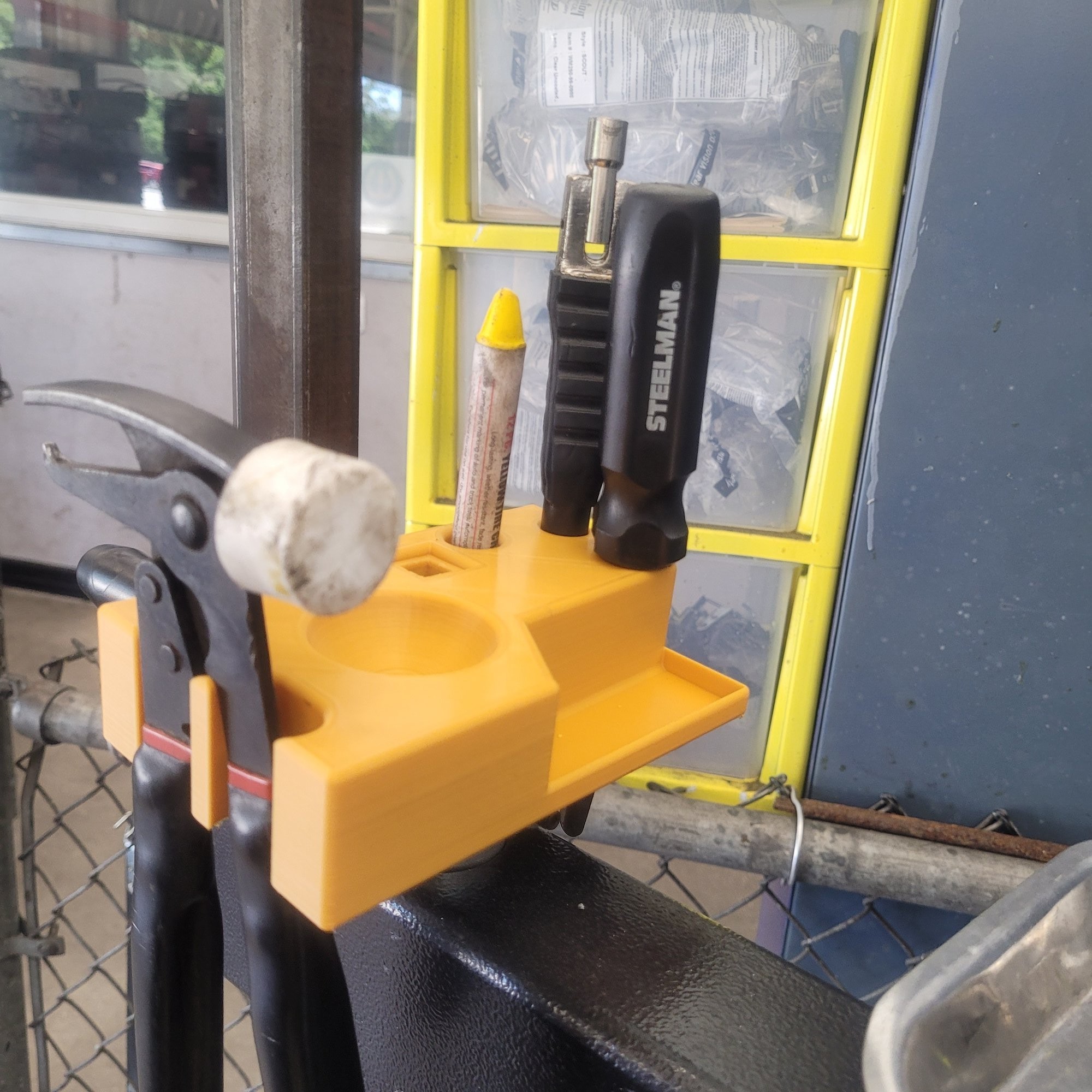 Tool holder installed on John Bean tire machine